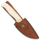 The fixed blade is housed in a premium, genuine leather belt sheath with a brass snap closure and attractive white stitching