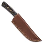 The 9” overall fixed blade knife slides securely into its premium, brown leather belt sheath for comfortable carry