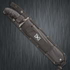 M48 combat machete enclosed in a black reinforced MOLLE sheath with "M48 Ops" logo printed in white.
