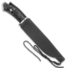 The bowie knife is shown secured into its leather belt sheath with lanyard cord.