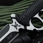 The 13 3/4” trench knife slides securely into an injection molded Vortec and nylon belt sheath, which has a snap closure strap