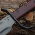 The bowie knife in its sheath