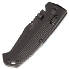 The comfortable black, textured aluminum handles scales have heavy jimping and the slide lock is easily accessible