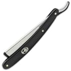 The black, grippy synthetic handle has a nickel silver Boker tree logo that was inlayed by hand
