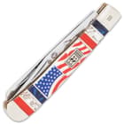 The white bone handle is 3D-printed with the American Flag, accented with red, pearl and blue panels and brass spacers