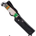 The 7 3/4” overall fixed blade knife slides like a glove into a premium black leather belt sheath for comfortable carry