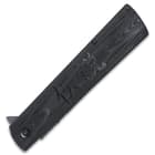 The black G10 handle scales are secured to the liners with heavy-duty screws and feature etched kanji.
