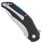 The handle scales are crafted of tough, black G10, secured with stainless steel screws, and accented with blue metal