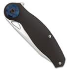 The Mavrokniv Black Spectre Pocket Knife handle scales are crafted of tough black G10, secured with stainless steel screws, and accented with blue metal