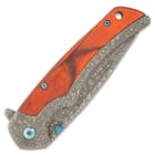 The handle is also crafted of DamascTec steel and features rich, wooden handle scales and a small lanyard hole
