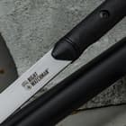 Single view of night watchman blade housed inside a black aluminum shaft with a nylon handle
