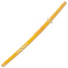 The 39” overall sword slides into a glossy yellow wooden scabbard with a shiny gold accent featuring a faux red jewel