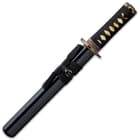 The 15 1/4” overall tanto sword fits like a glove in a black, lacquered wooden scabbard with black cord accents