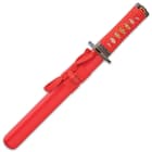 The 15 1/4” overall tanto sword fits like a glove in a red, lacquered wooden scabbard with red cord accents