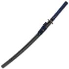 The 27 1/2” blade slides perfectly into a black lacquered, wooden scabbard accented with dark blue cord-wrap