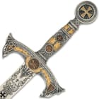 The Templars Sword has an ornate hilt with gold and black designs that carry on down the blade. 