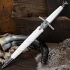 A hard plastic, white scabbard matches the sword