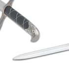 The curved pommel and the blade of the sword displayed