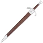 Honshu medieval sword in a smooth brown leather scabbard with polished metal accents on the tip and base
