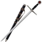 The black scabbard wrapped in leather strap matches the black handle of the sword. 
