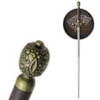 The sword is shown hanging on a wall plaque with Direwolf sigil and with zoomed view of the sword’s ornate pommel. 