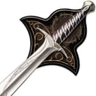 Zoomed view of Sting sword of Frodo with runes on the silver blade and handguard displayed on top of wooden plaque
