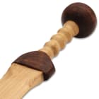 The 27” overall gladius is made of solid, natural ash wood with a brown contrast finish decorating its pommel and guard