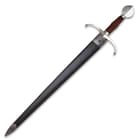 The 36” overall sword slides smoothly into a black leather scabbard, accented with a metal throat and tip