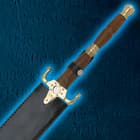 The hardwood handle of the sword is shown with brass pommel and guard and is secured by a strap into the leather scabbard. 