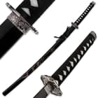 The katana is shown inside the scabbard with dragon design and with zoomed views of the hibaki and cast steel tsuba. 
