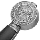 Silver pommel says King Arthur Excalibur with a dragon embossed in the center
