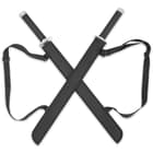 Each of the twin swords has a shoulder harness black sheath. 