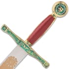 The 11 1/4” overall, reproduction miniature sword has an intricately designed metal alloy and red leather handle