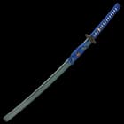 The 41 7/10” katana slides smoothly into a dark blue, lacquered wooden scabbard with a gold mottled design
