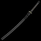 The 41 3/10” overall katana fits smoothly into its black lacquered, wooden scabbard with has black cord-wrap accents