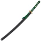 The 40 9/10” overall katana slides smoothly into a black lacquered scabbard, accented with green cord-wrap