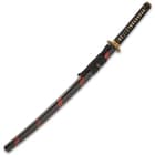 The 41” overall katana slides securely into a black lacquered wooden scabbard, which has red band accents