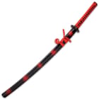 The 41”, overall katana slides like a glove into a black, lacquered wooden scabbard, accented with red cord-wrap