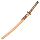 The 39 1/2” overall katana fits like a glove in its premium wooden scabbard, which has a natural, glossy finish and cord accents