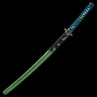 The 40 9/10”” overall katana slides smoothly into its green wooden scabbard, which has a black splatter-paint design and cord-wrap