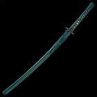 The 40” overall katana slides smoothly into a black, lacquered scabbard, accented with teal cord-wrap to match the handle