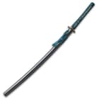 Katana with tsuka wrapped in a teal cord and tea dyed rayskin encased in black scabbard with a teal cord around a brass knob
