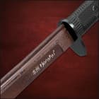 Honshu katana encased in black wooden saya wrapped in black leather rope that leads to steel handguard and rugged TPR tsuka
