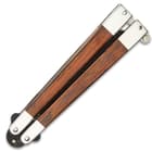 The titanium black stainless steel blade flipped into the genuine cocobolo wood handles.
