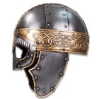 A real showpiece, this lavish, masked helmet is crafted of 18-gauge steel with steel studs and is detailed in brass