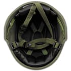 This ballistic nylon helmet is in used condition and has an adjustable liner and chin strap, plus inside padding for comfort