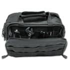 The toolkit bag has a large, main zippered compartment that contains individual slots to store tools and other gear