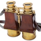 They are crafted of solid, polished brass and a beautiful reddish-brown wood and feature a leather neck strap