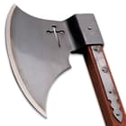 The axe has a large sharpened, 9 5/8” steel axe head, which has a cross cut-out and features langets for extra support