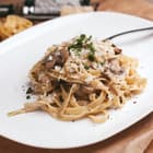 A plate of mushrooms with pasta